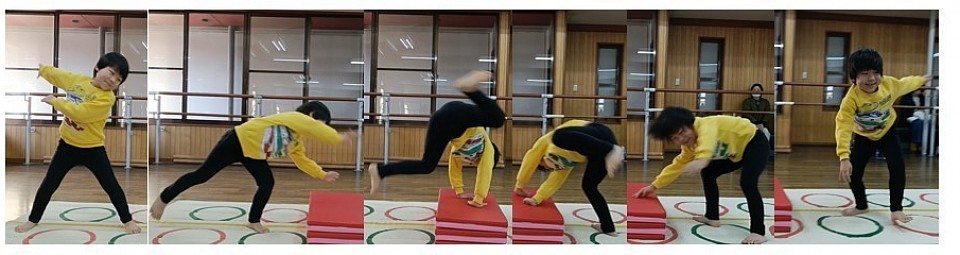 側転の指導初期段階、段差を利用して動きを覚えてもらいます。1年生Y君「台つき側転」合格！
